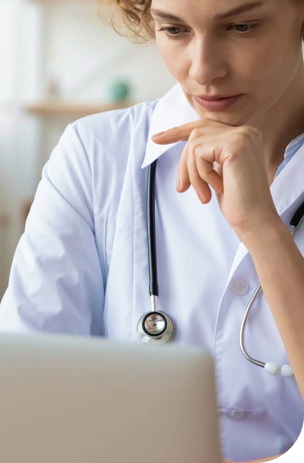 Female doctor in white coat with stethoscope